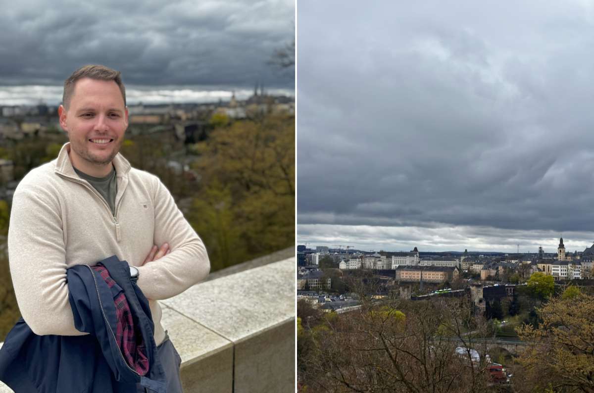 Tourist at the Grand Duchess Charlotte Bridge viewpoint overlooking Luxembourg City, Luxembourg, photo by Next Level of Travel