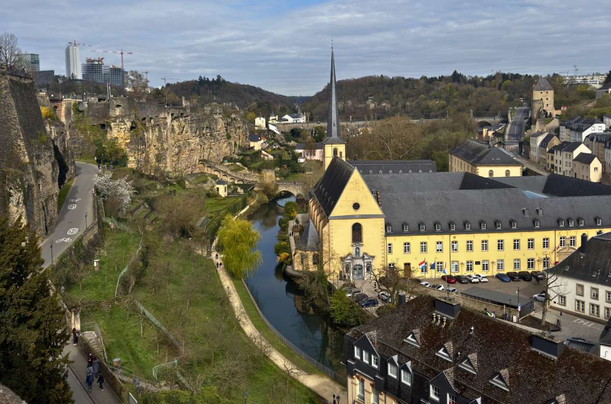 View of the Alzette Valley, Neumünster Abbey, and St. John Church from Chemin de la Corniche, Luxembourg City, Luxembourg, photo by Next Level of Travel