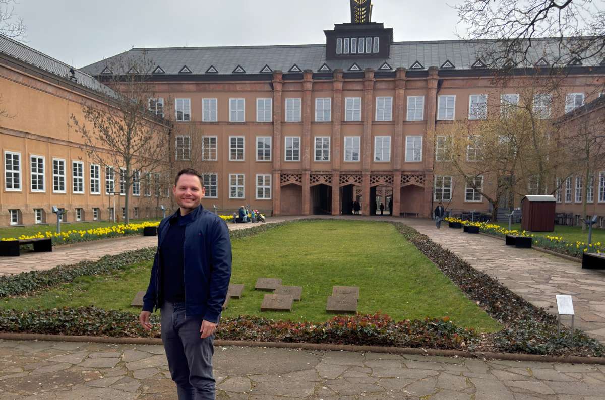 a photo of a tourist posing in front of the Grassi Museum in Leipzig, Germany, photo by Next Level of Travel
