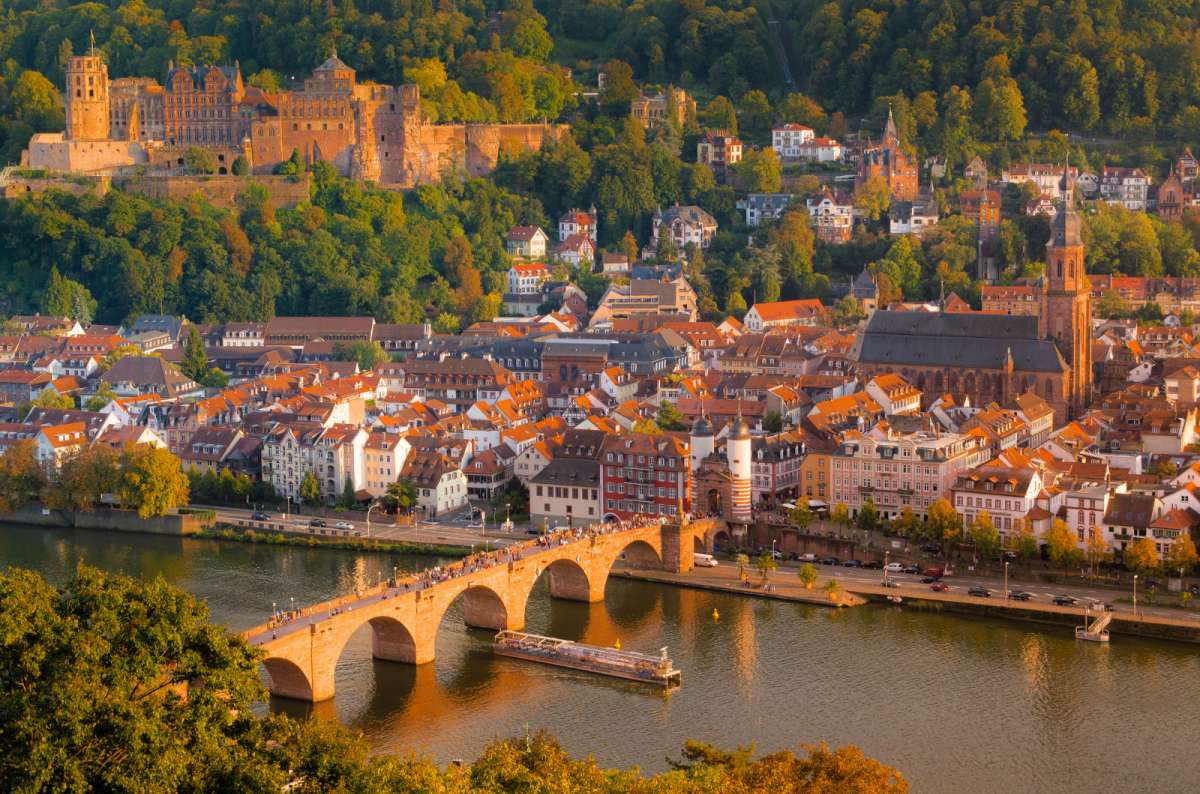 a photo of Heidelberg city center, with the river and the classic bridge, Germany