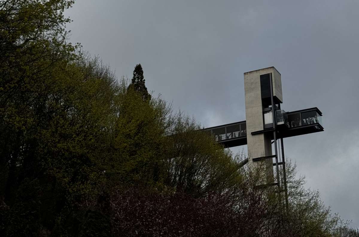 a photo of the Pfaffenthal elevator tower and pedestrian bridge at the top, overlooking the city, Luxembourg, photo by Next Level of Travel