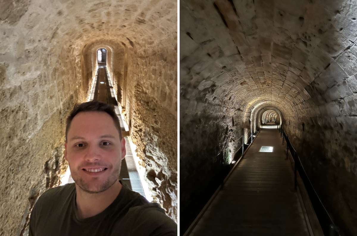 A tourist in a rock-cut tunnel of the Bock Casemates, Luxembourg City, Luxembourg, photo by Next Level of Travel
