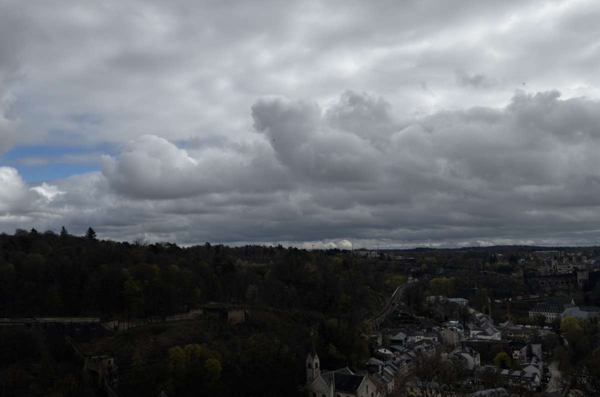 A wide, grey-sky view over the city and valley, Luxembourg City, Luxembourg, photo by Next Level of Travel