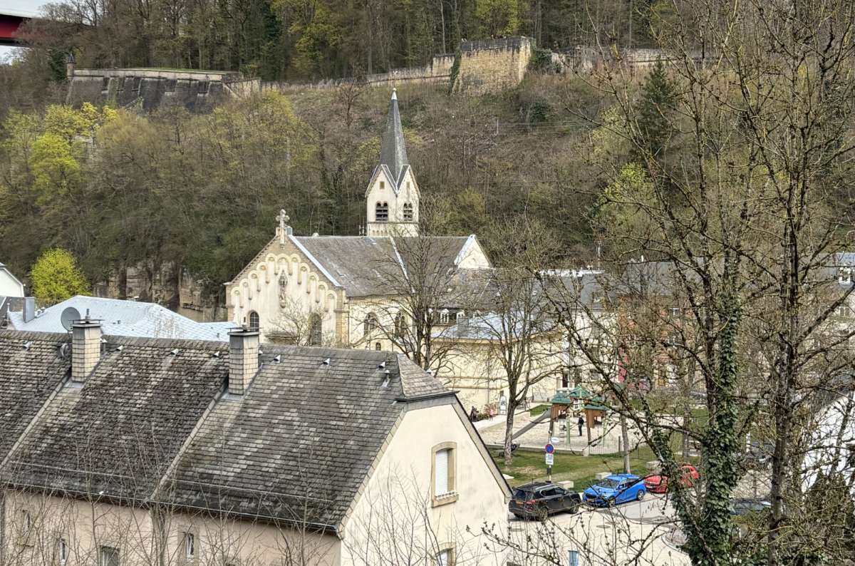 Old houses tucked into the valley below the upper city, Luxembourg City, Luxembourg, photo by Next Level of Travel