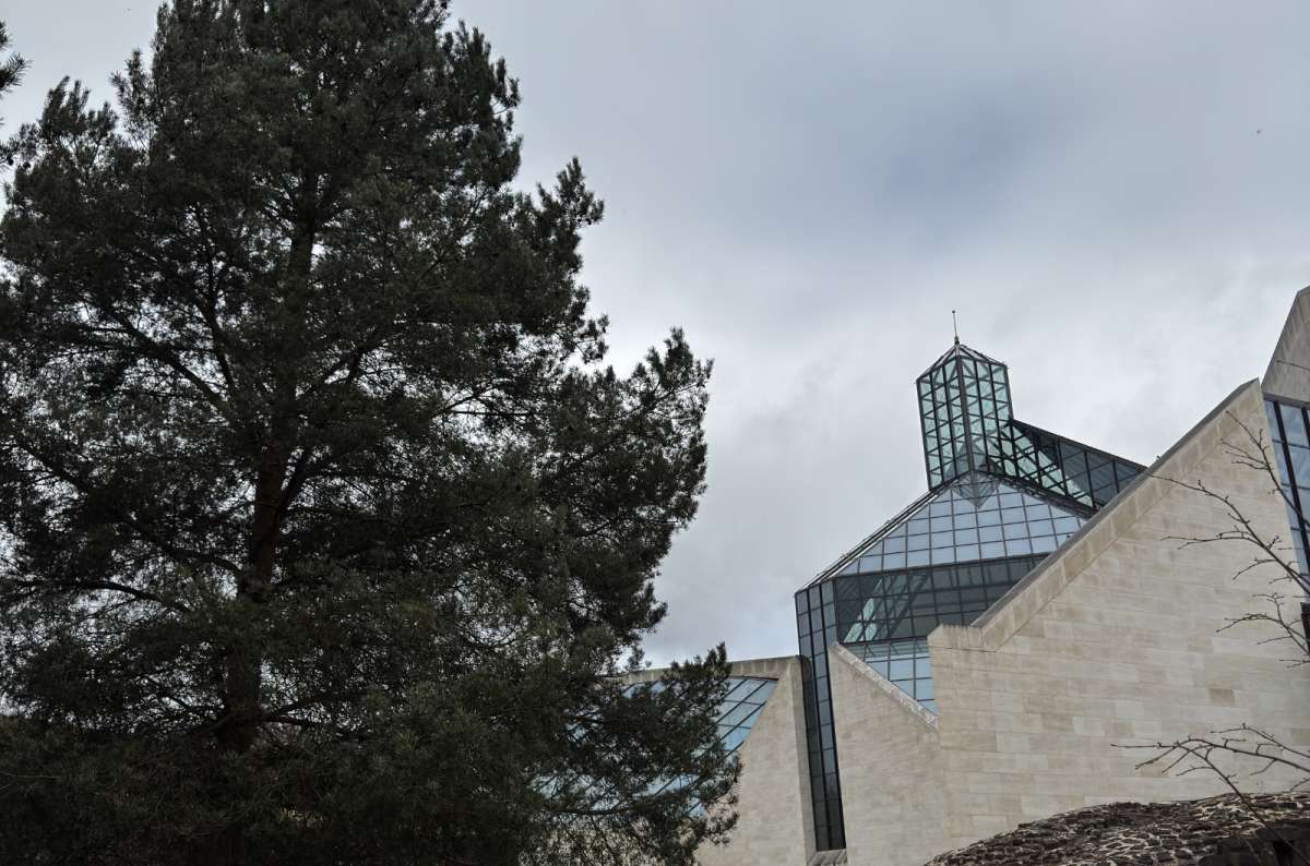 The Mudam museum and Kirchberg architecture behind pine trees, Luxembourg City, Luxembourg, photo by Next Level of Travel