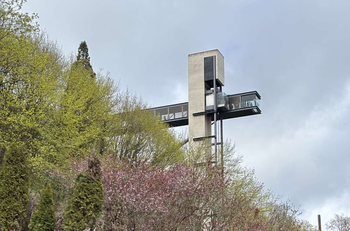 The Pfaffenthal panoramic elevator tower rising beside spring blossom above the valley, Luxembourg City, Luxembourg, photo by Next Level of Travel