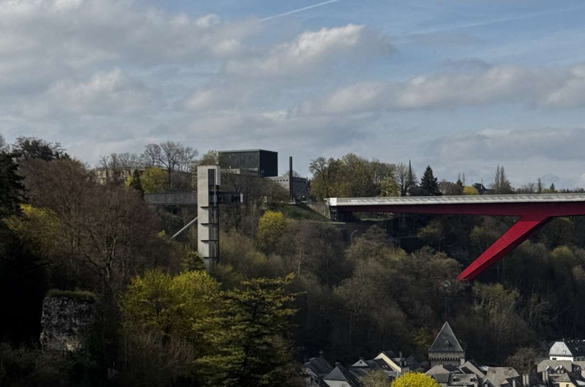 The red Grand Duchess Charlotte Bridge spanning the valley, Luxembourg City, Luxembourg, photo by Next Level of Travel 