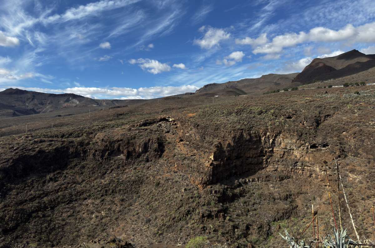 the barren volcanic rim and crater landscape of the Caldera de Bandama in Gran Canaria, Canary Islands, photo by Next Level of Travel