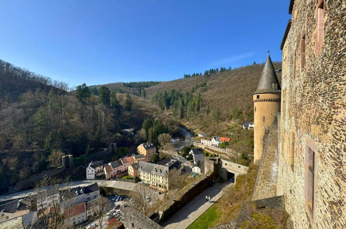 View from the walls of Vianden Castle overlooking the castle exterior and the town of Vianden in Luxembourg