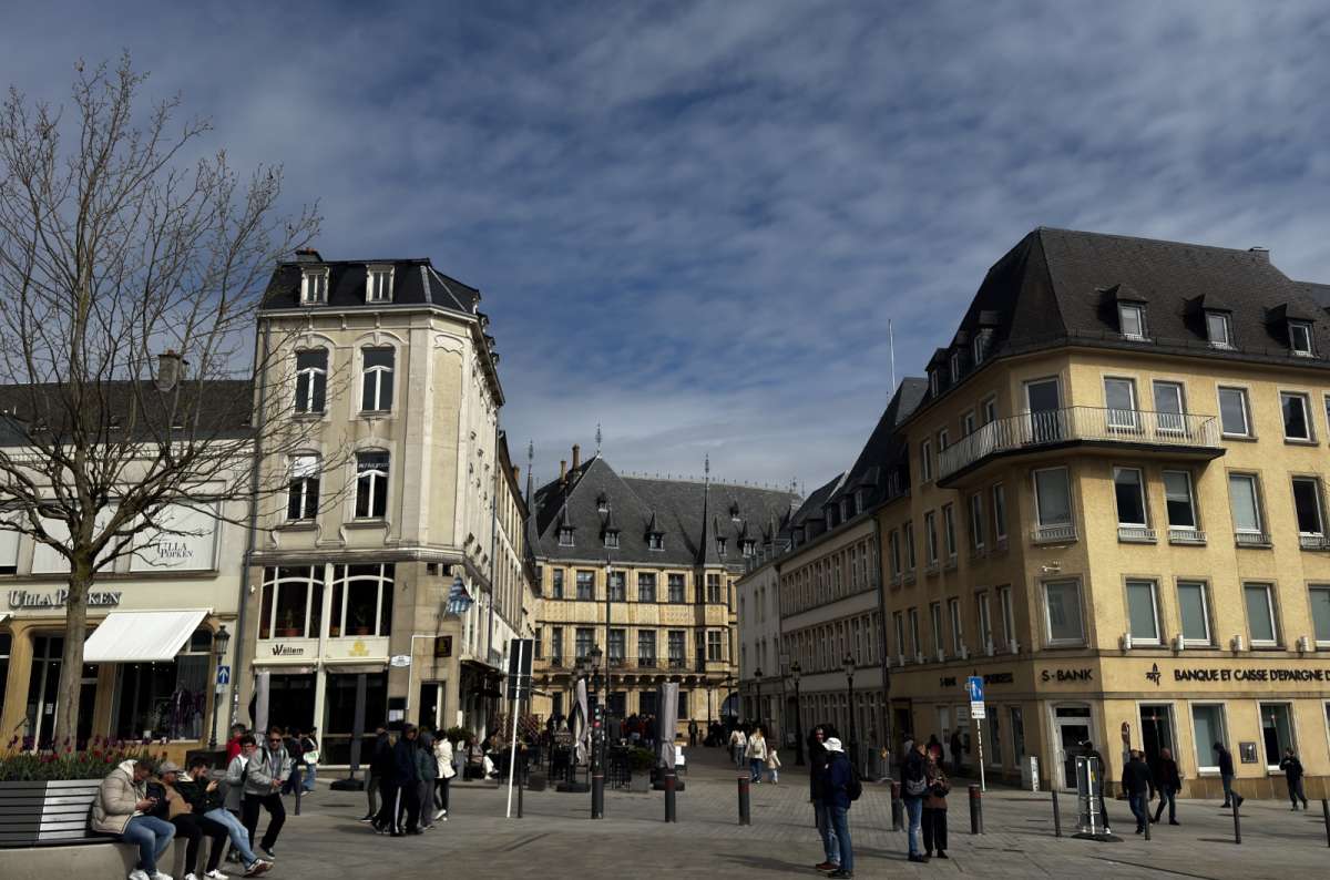 A central city square lined with townhouses and cafés, Luxembourg City, Luxembourg, photo by Next Level of Travel