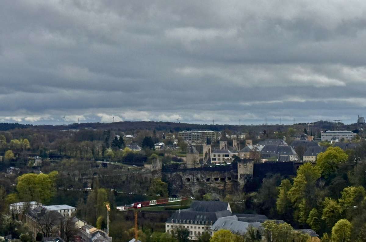 A panorama across the upper and lower city under a cloudy sky, Luxembourg City, Luxembourg, photo by Next Level of Travel 