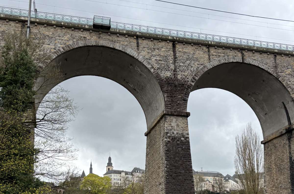 A railway viaduct arching across the valley above the lower city,  Luxembourg, photo by Next Level of Travel 