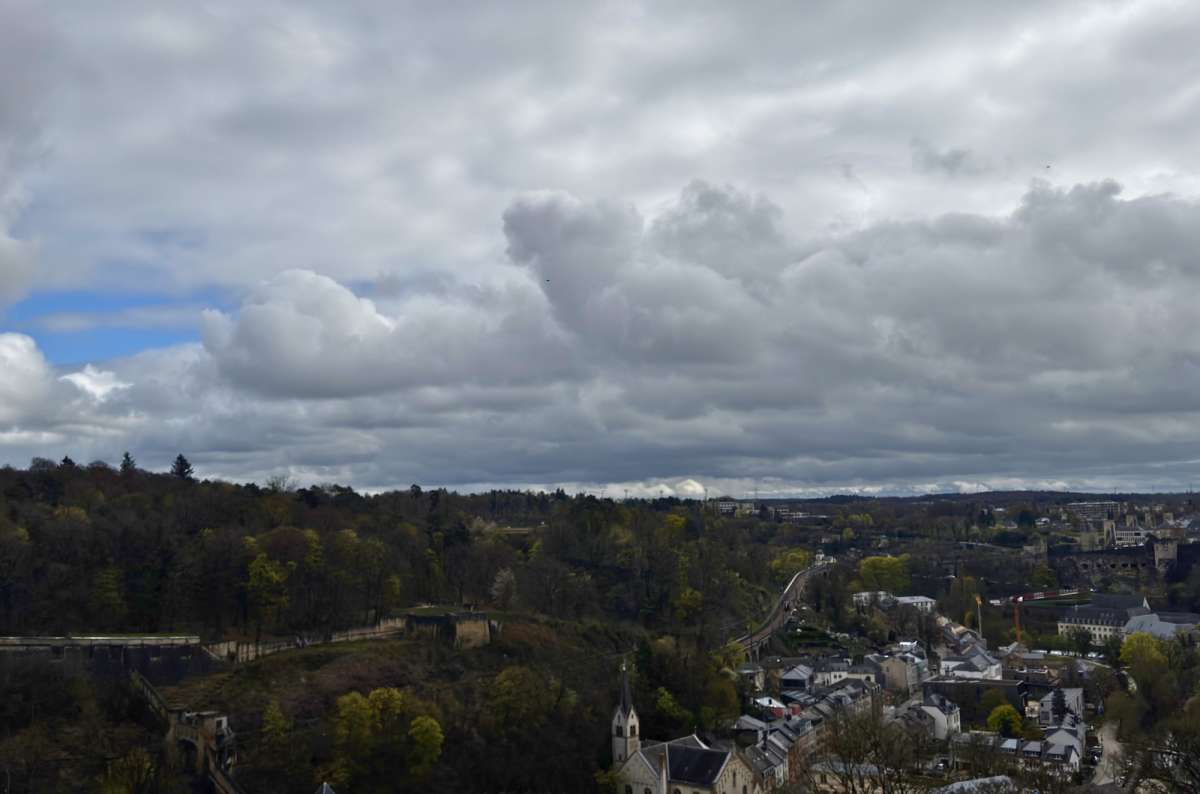 A wide, grey-sky view over the city and valley, Luxembourg City, Luxembourg, photo by Next Level of Travel 