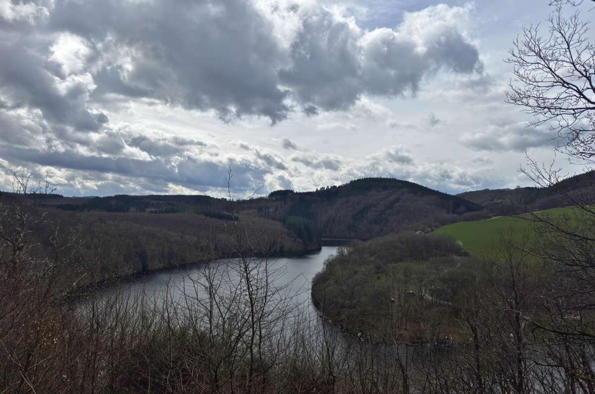 The Sûre river winding through forested hills, Luxembourg, photo by Next Level of Travel