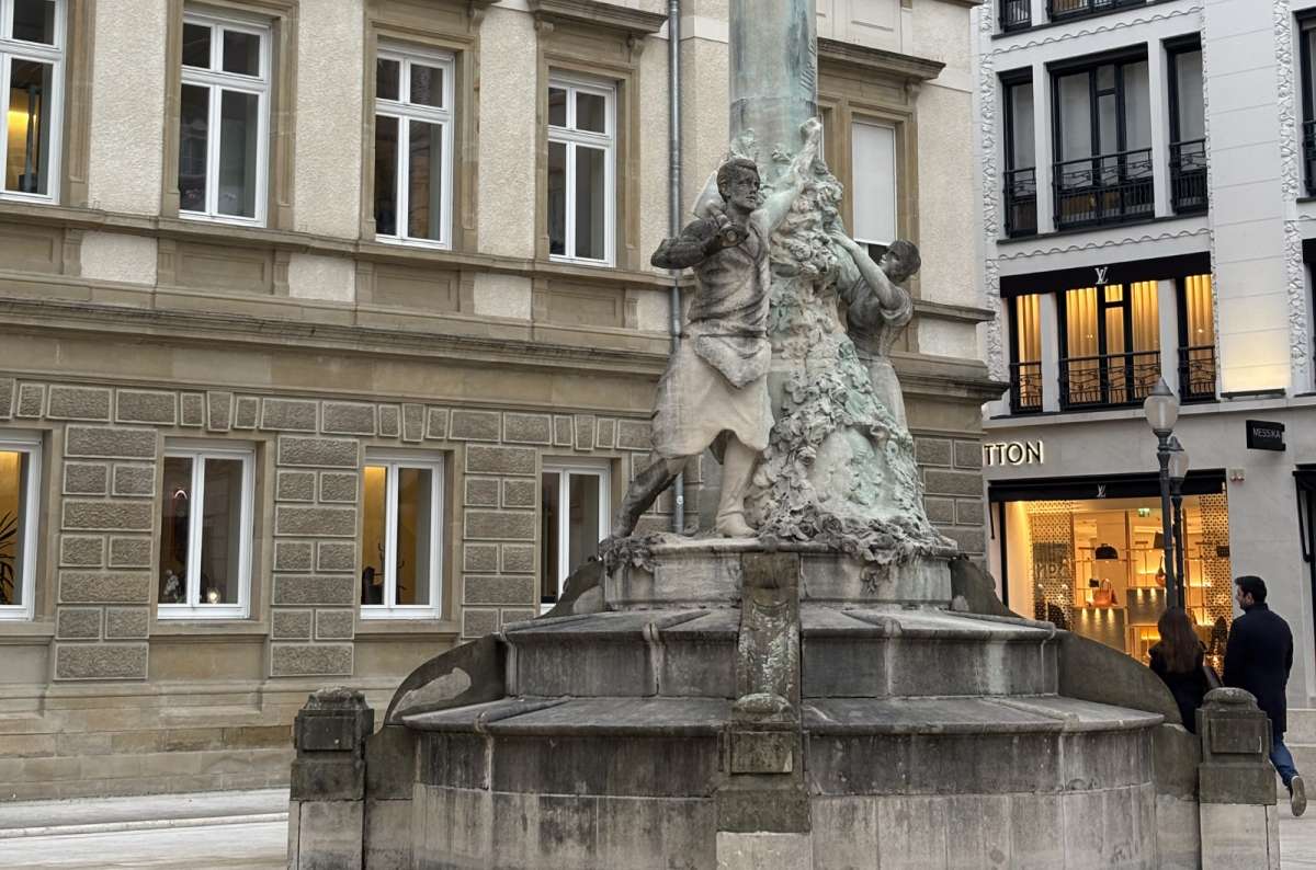 A fountain and townhouses in a central city square, Luxembourg City, Luxembourg, photo by Next Level of Travel