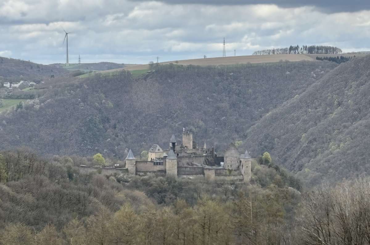 Bourscheid Castle on its distant hill across the valley, Bourscheid, Luxembourg, photo by Next Level of Travel