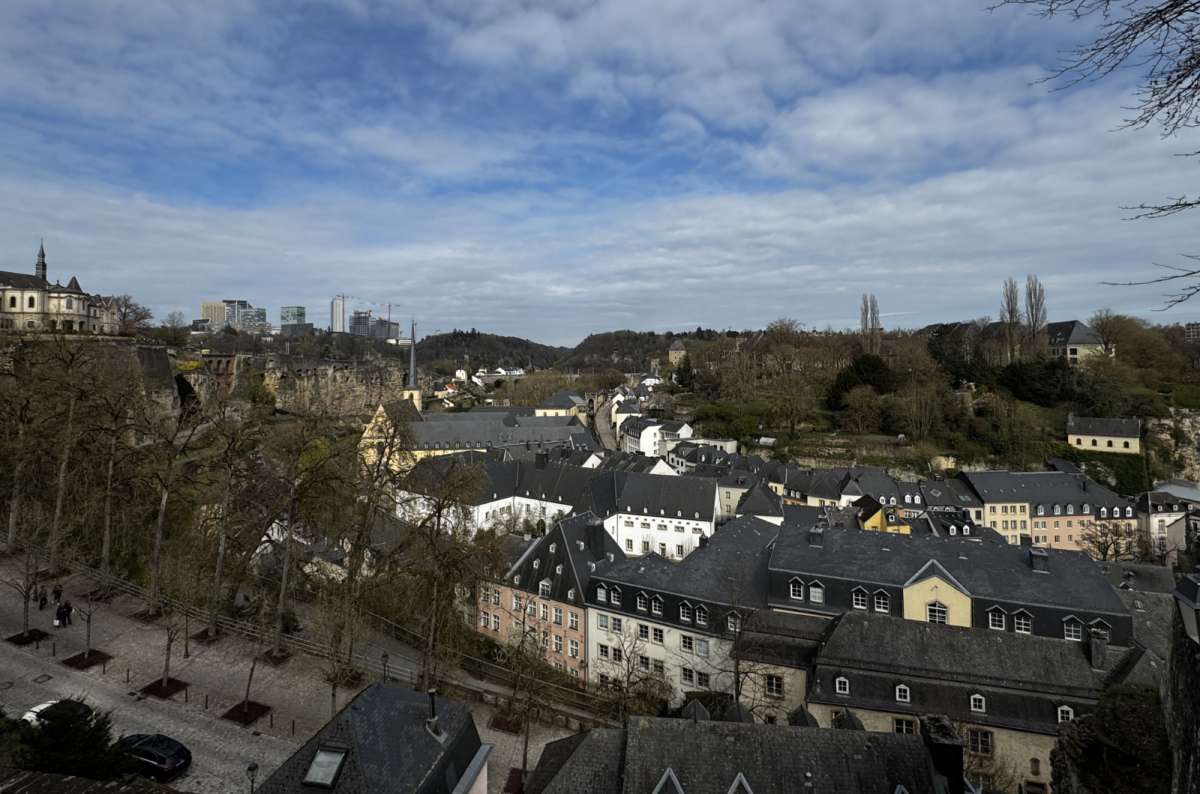 Rooftops of the lower city spread out below the cliffs, Luxembourg City, Luxembourg, photo by Next Level of Travel