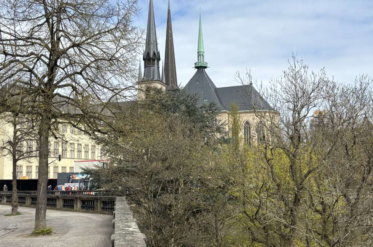The twin spires of Notre Dame Cathedral seen from a walkway above the valley, Luxembourg City, Luxembourg, photo by Next Level of Travel