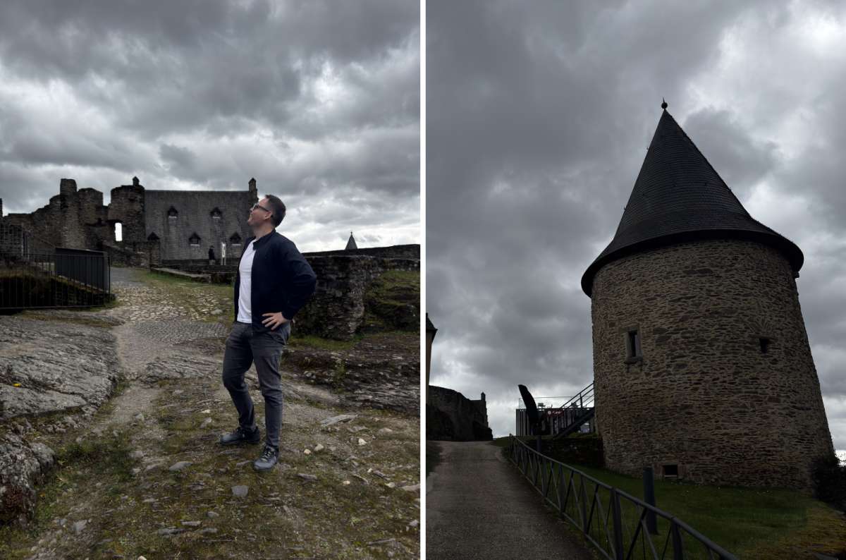 a photo of a tourist among the towers and gate of the ruined Bourscheid Castle, Bourscheid, Luxembourg, photo by Next Level of Travel 
