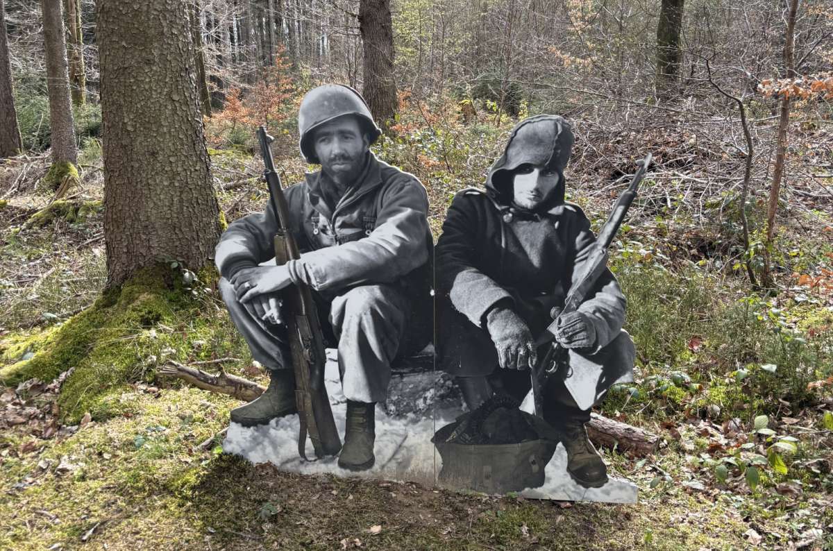 a photo of soldier sculptures on the Schumannseck WWII memorial trail in a forest, Schumannseck, Luxembourg, photo by Next Level of Travel