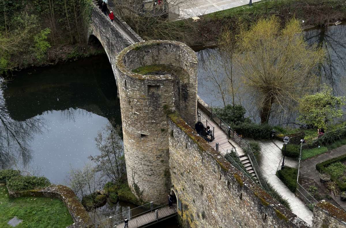 a photo of the Alzette river, bridges and fortifications of the Grund seen from above, Luxembourg City, Luxembourg, photo by Next Level of Travel 