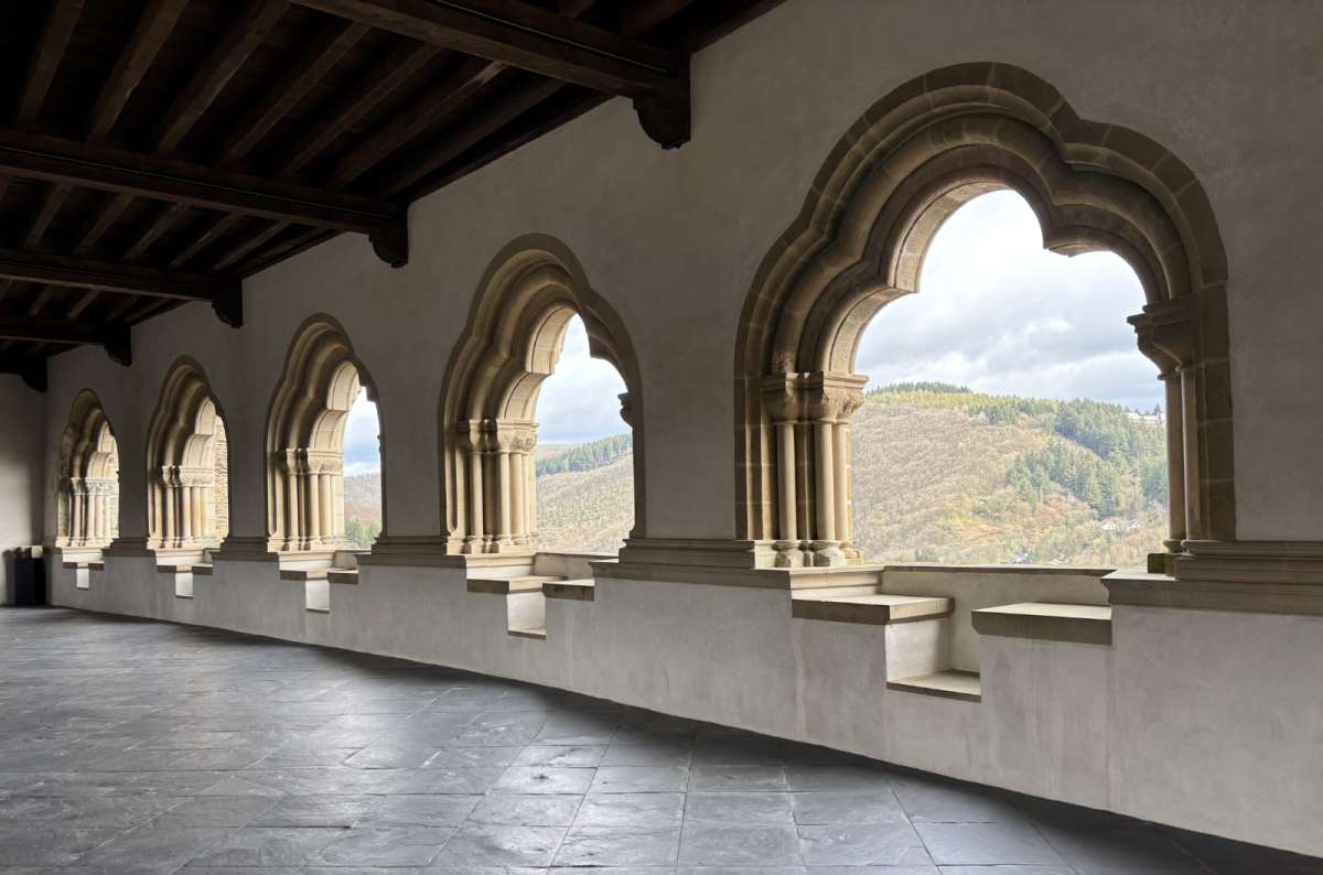 a photo of the arched gallery and chapel columns inside Vianden Castle, Vianden, Luxembourg, photo by Next Level of Travel