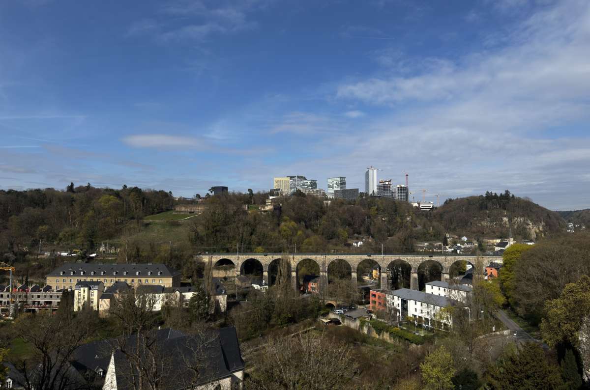 a photo of the railway viaduct arches crossing the valley above the city, Luxembourg City, Luxembourg, photo by Next Level of Travel