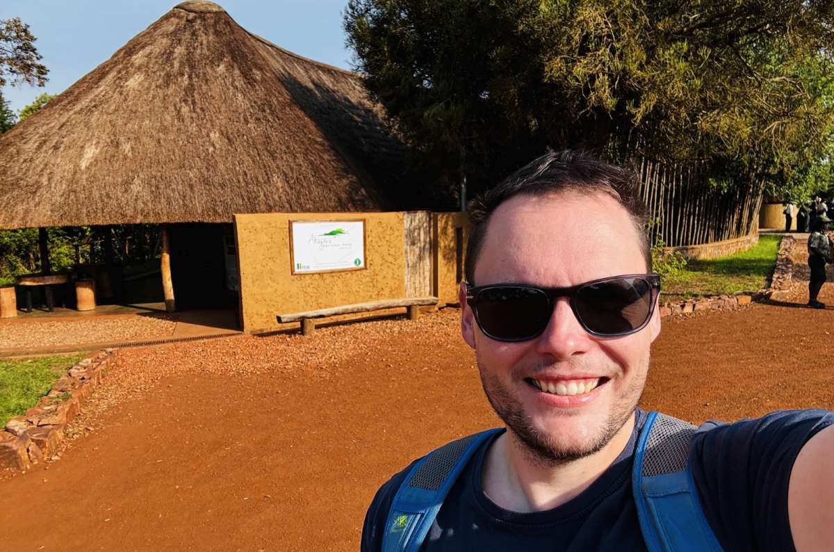 a photo of a thatched safari lodge banda glowing at sunset, Akagera National Park, Rwanda, photo by Next Level of Travel