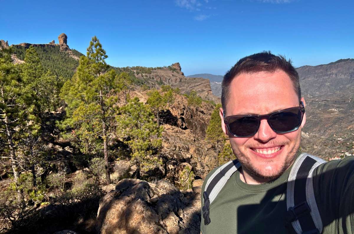 a photo of a tourist taking a selfie with Roque Nublo in the background, Gran Canaria, photo by Next Level of Travel