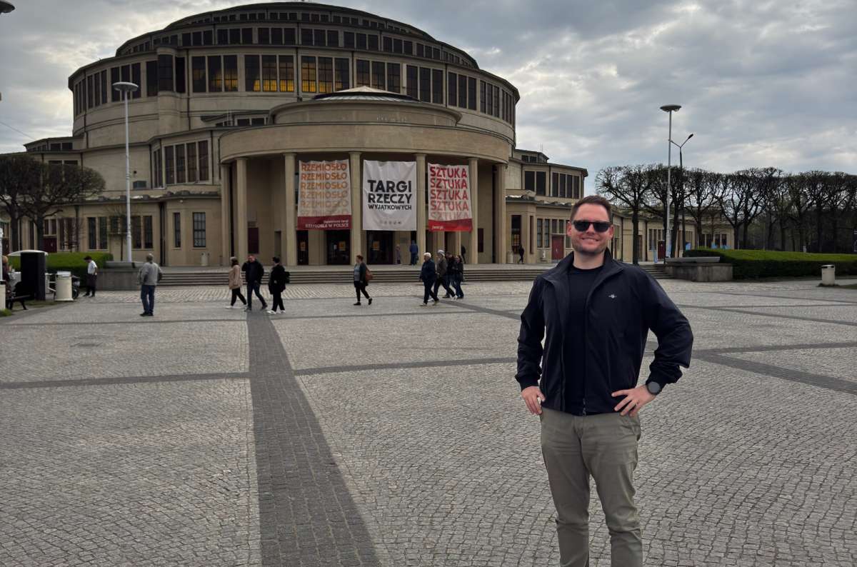 a photo of a torusit posing in front of the Centennial Hall in Wroclaw, Poland, photo by Next Level of Travel