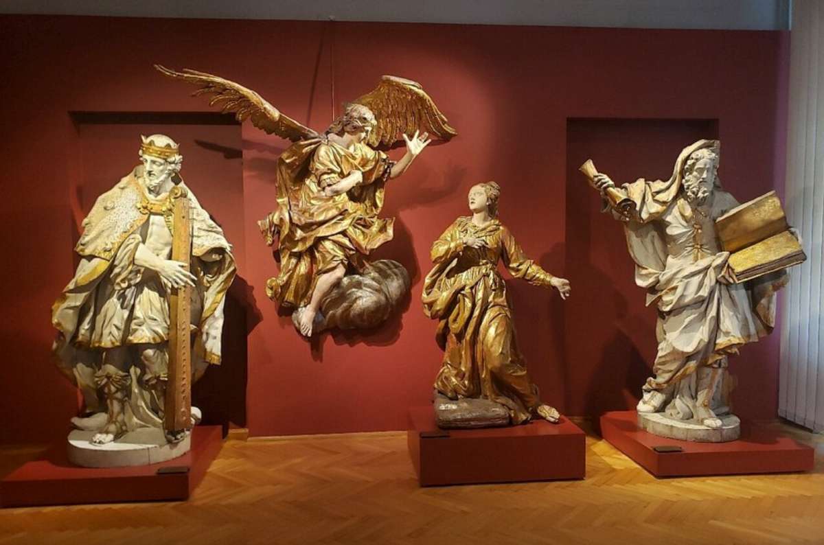 a photo of the exhibited pieces in the National Museum in Wroclaw, showing the decorative statues in angels and kings, Poland