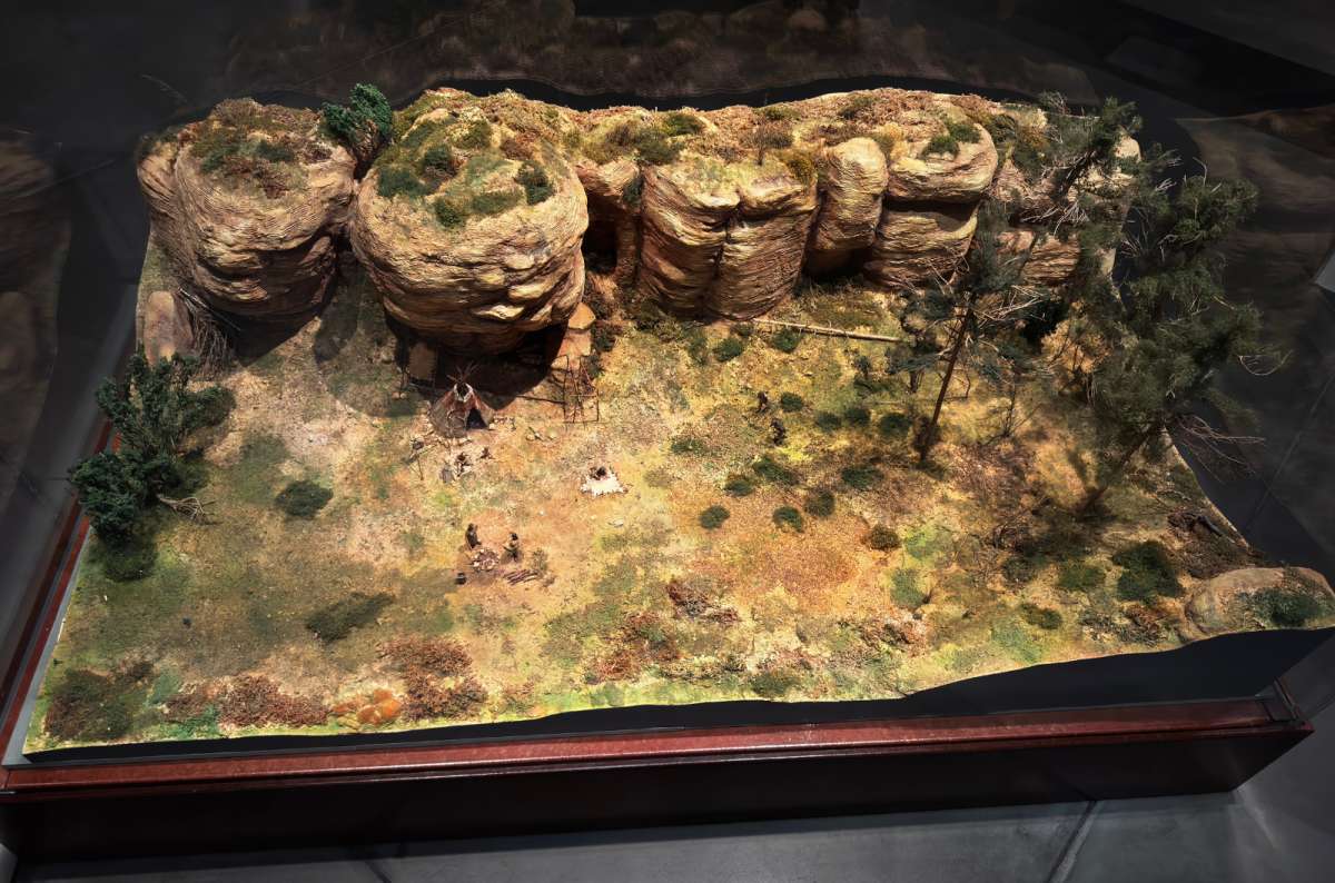 a photo of a small model of a prehistoric village with sandstone cliffs in the National Museum of History and Art, Luxembourg, a photo by Next Level of Travel