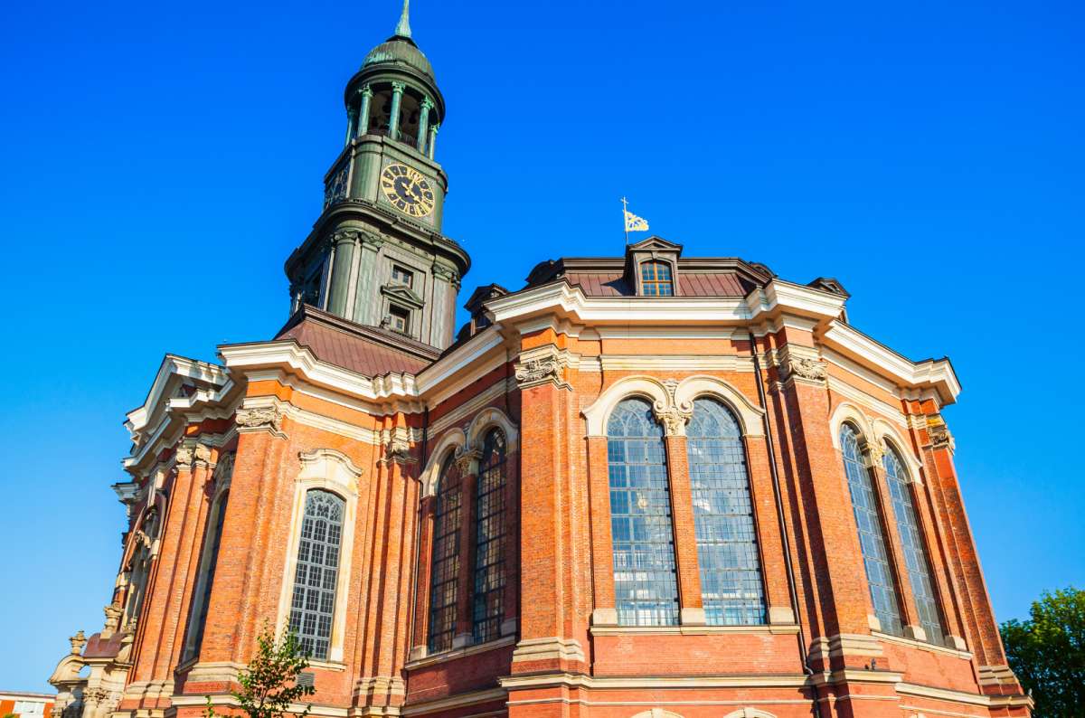 a photo of St. Michael's Church exterior with focus on its decorative bell tower, Hamburg, Germany