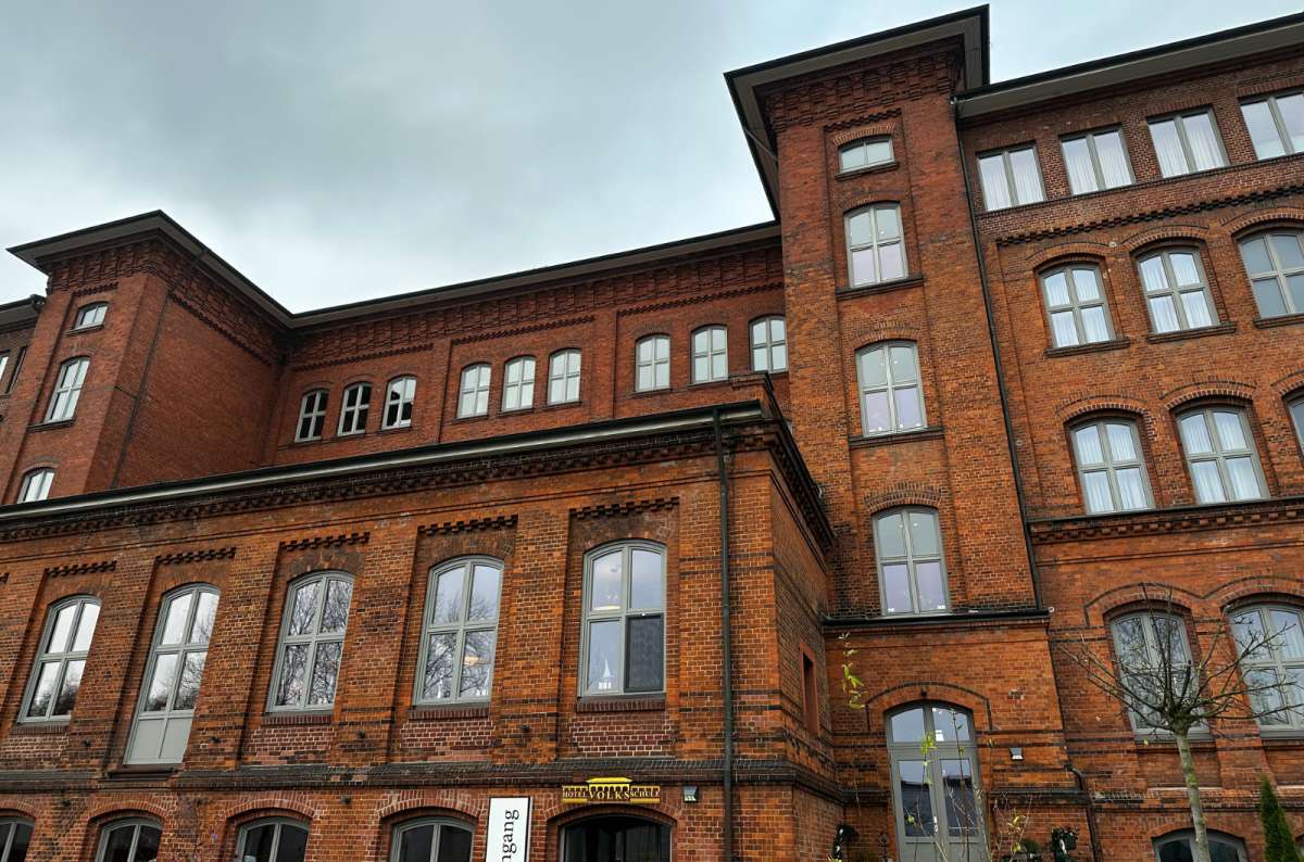 a photo of the Volksschule exterior, showing its characteristic brick color, Hamburg, Germany, photo by Next Level of Travel