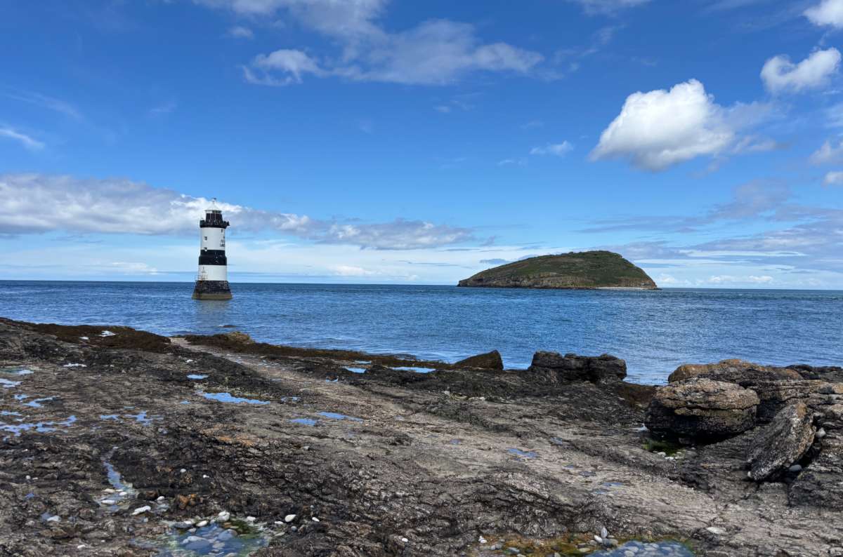 photo of Penmon Point lighthouse with Puffin Island in the distance, Anglesey, photo by Next Level of Travel