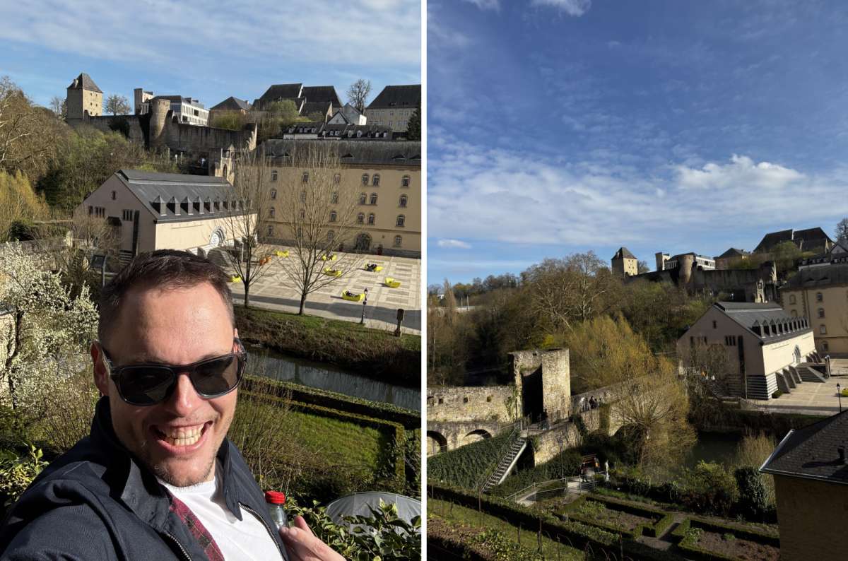 A tourist with the rooftops and spires of the old town behind, Luxembourg City, Luxembourg, photo by Next Level of Travel