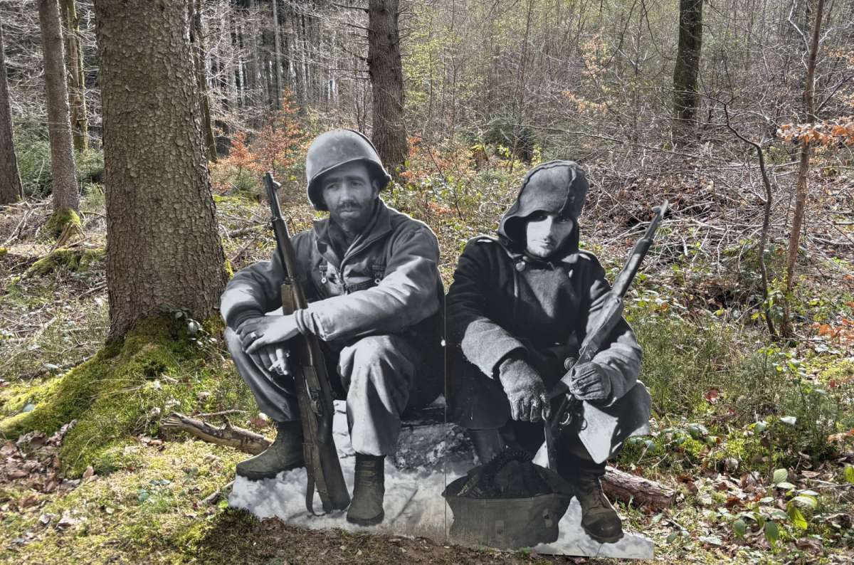 Soldier sculptures on the Schumannseck WWII memorial trail in a forest, Schumannseck, Luxembourg, photo by Next Level of Travel