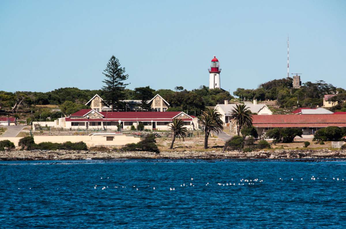 View of Robben Island with the lighthouse from Cape Town, South Africa