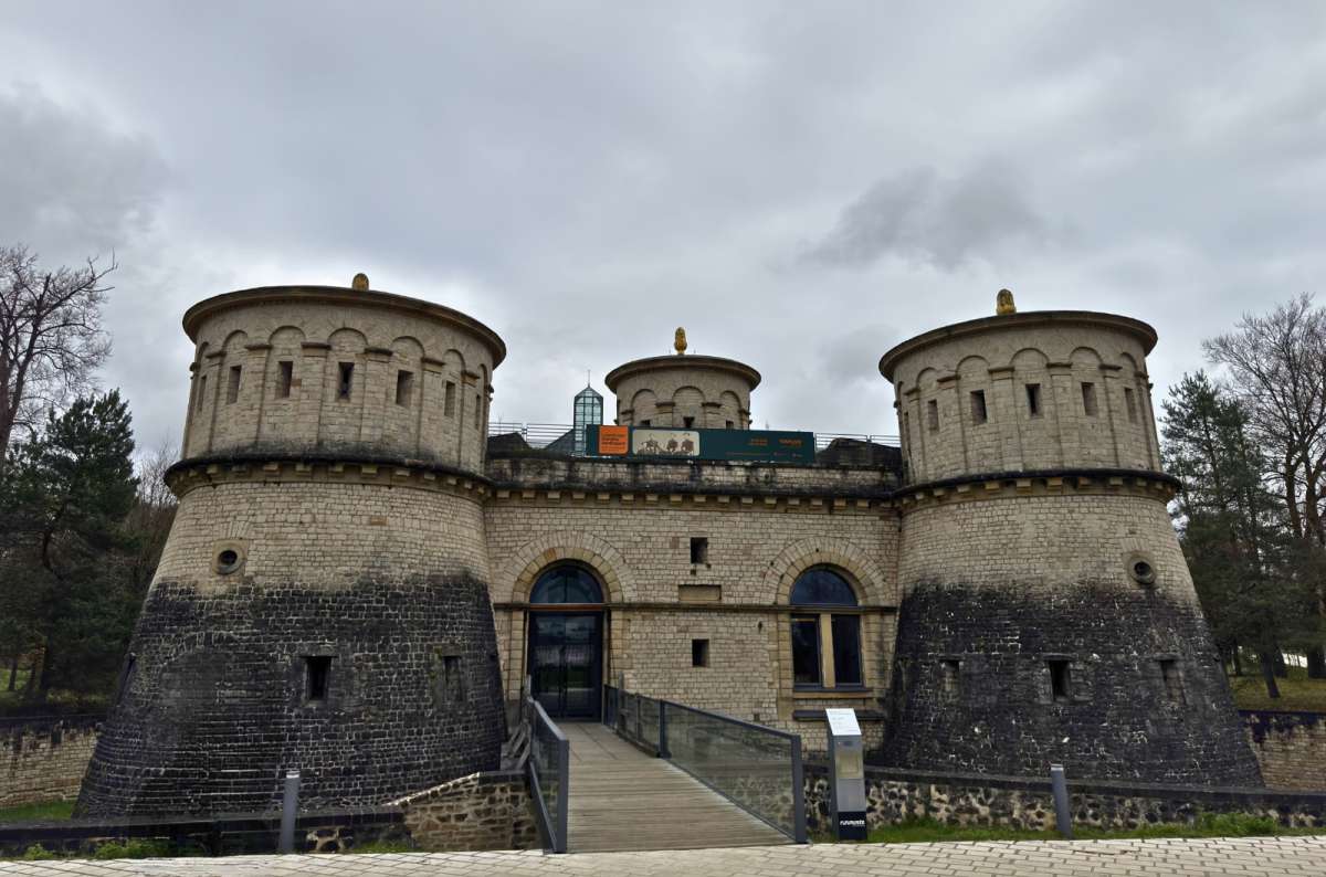 a photo of the exterior of Musee Drai Eechelen, the three-towered 19th-century fortress museum at the edge of the old fortifications, Luxembourg, photo by Next Level of Travel