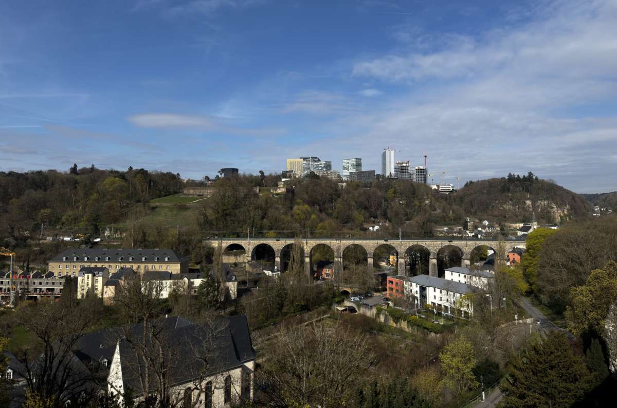 a photo of the pont Adolphe from far away, showing the valley below, Luxembourg, photo by Next Level of Travel