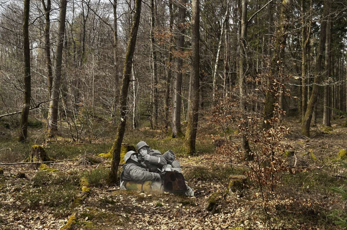 a photo of the Schumannseck Memorial Trail in Luxembourg, featuring photographic installations of World War II Allied soldiers in the forest, Luxembourg, photo by Next Level of Travel