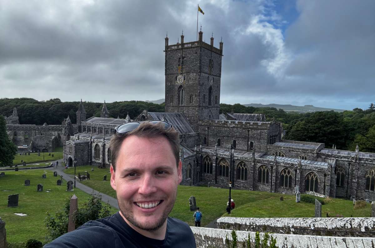 a photo of a tourist taking a selfie above St Davids Cathedral and its churchyard, St Davids, Wales, photo by Next Level of Travel