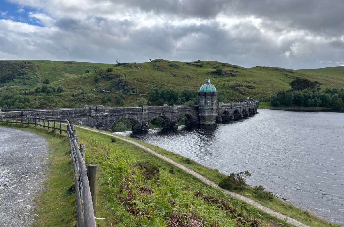 a photo of the domed tower and arches of Pen y Garreg dam across the reservoir, Elan Valley, Wales, photo by Next Level of Travel