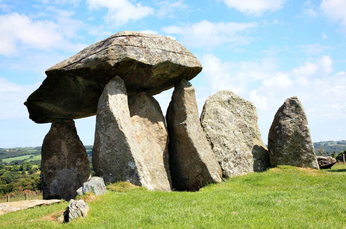 a photo of the Pentre Ifan neolithic burial chamber with its huge balanced capstone, Pembrokeshire, Wales