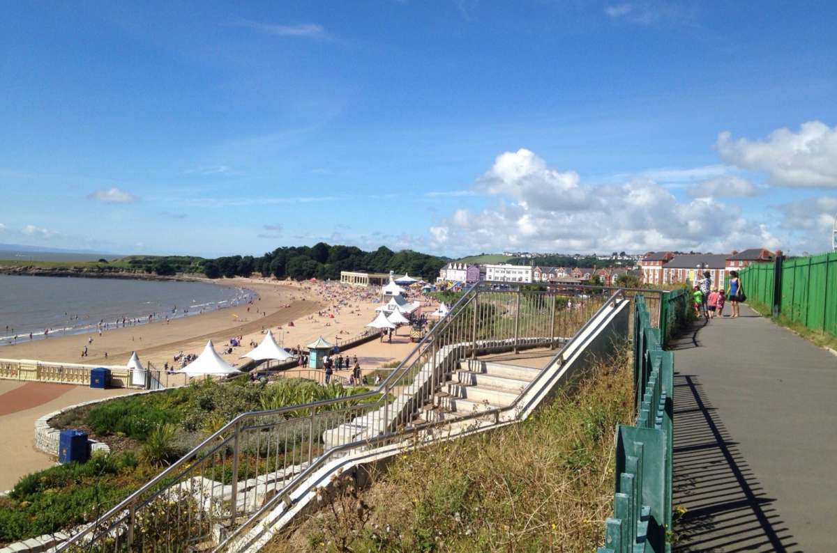 a photo of the sandy beach and promenade at Barry Island on a sunny day, Barry Island, Wales