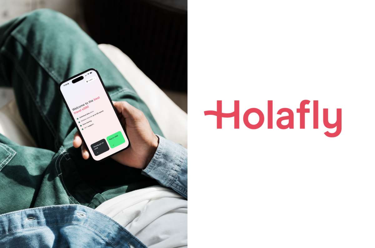 a photo of a person holding a phone showing the Holafly app's welcome screen with the buy an eSIM button