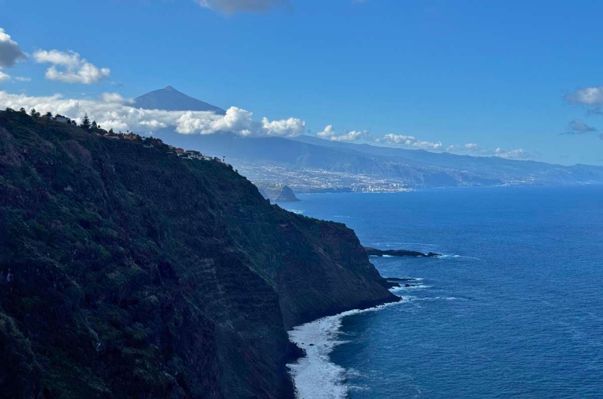 a photo of coastal cliffs with Mount Teide in the distance, Mirador 500 Escalones, photo by Next Level of Travel