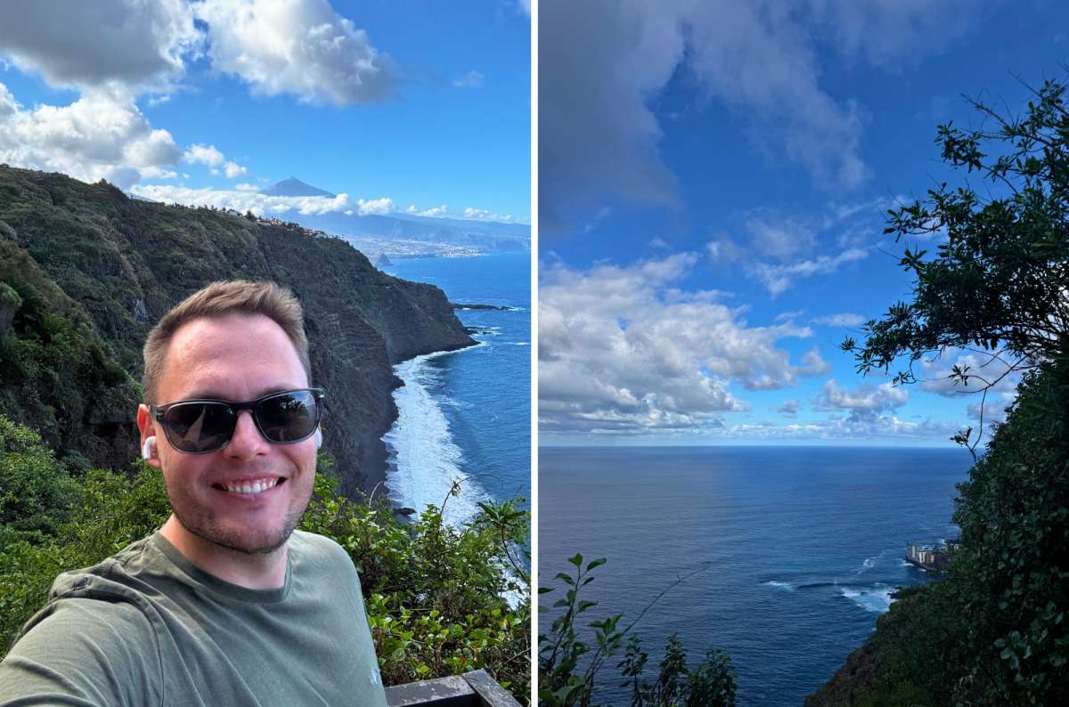 hoto of a tourist with a black sand beach and Mount Teide in the background on the left and an ocean view through trees on the right, Mirador 500 Escalones, photo by Next Level of Travel
