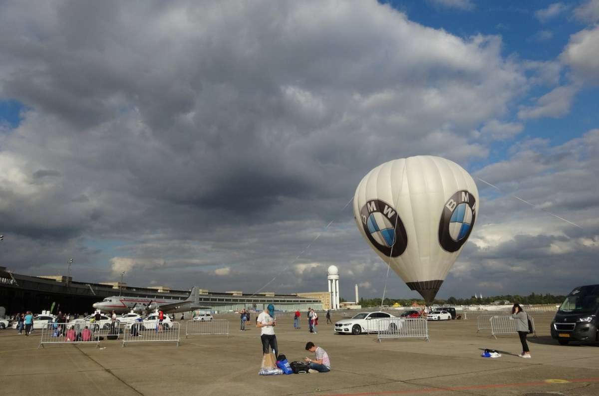 A photo showing a hot air balloon with BMW logo on the apron of the Tempelhoferfeld in Berlin, Germany