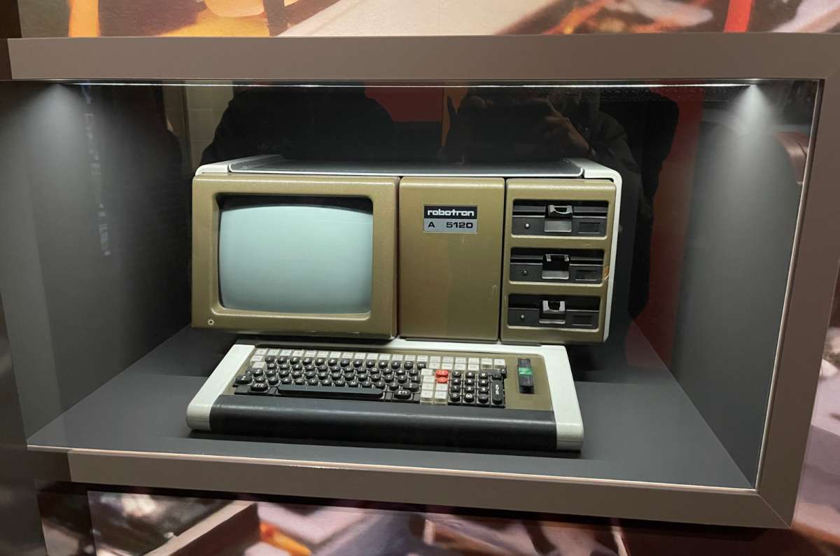 A photo showing a vintage East German Robotron A 5120 computer inside a museum display case, Germany, a photo by Next Level of Travel
